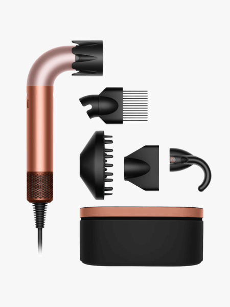 Dyson Supersonic r Hair Dryer and attrachments and case on a light gray background